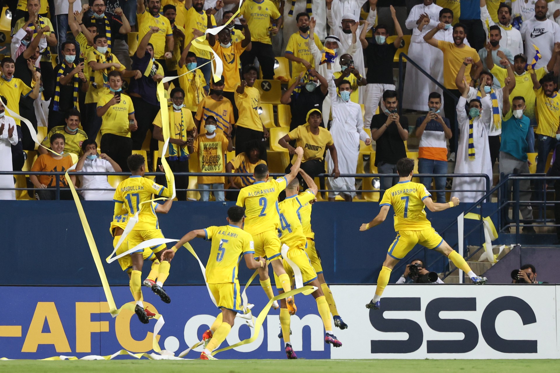nassr players celebrate goal afc champions league