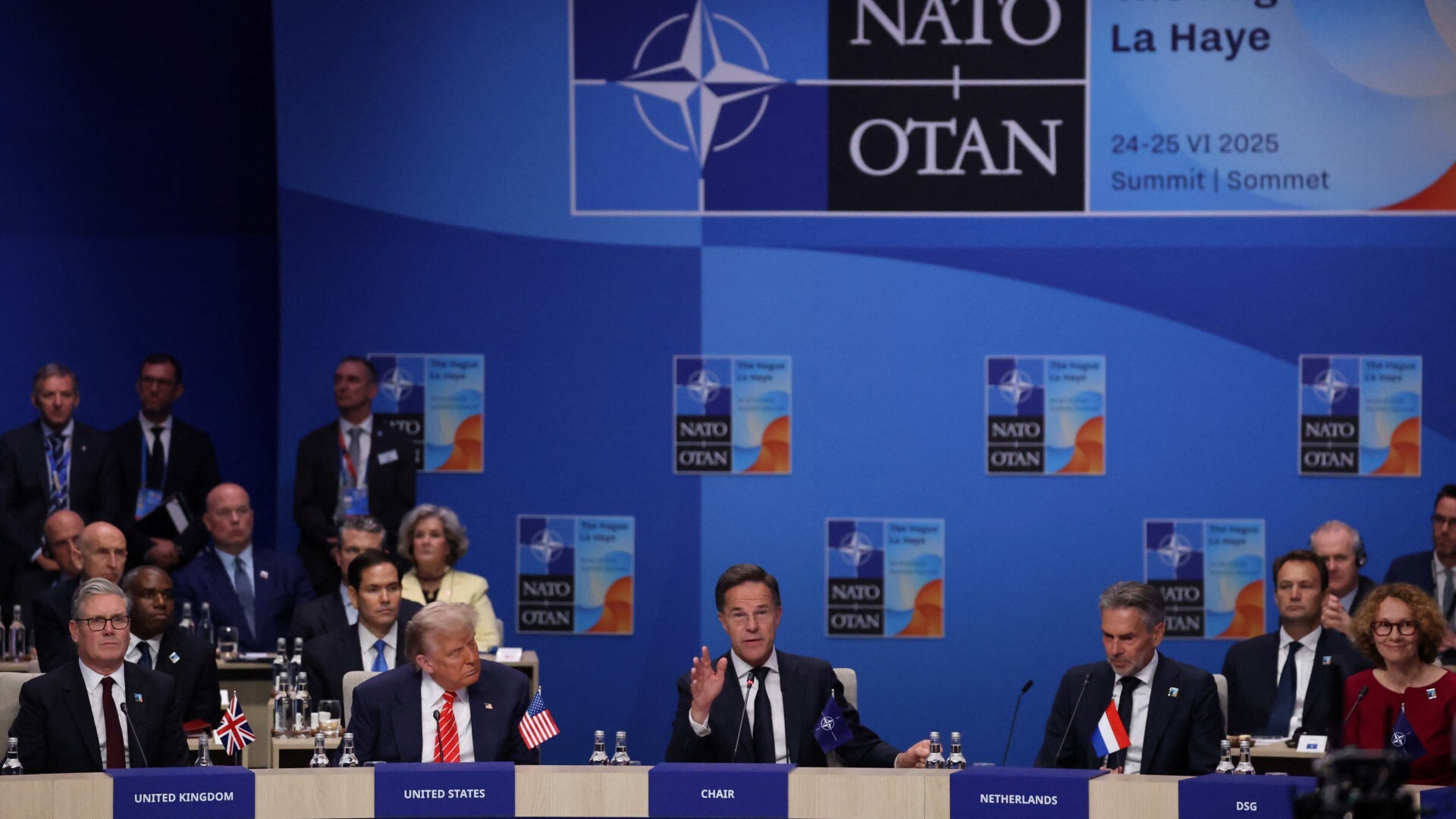 NATO Secretary General Mark Rutte, flanked by US President Donald Trump and other national leaders during a NATO summit in The Hague, Netherlands June 25, 2025 (REUTERS/Toby Melville)