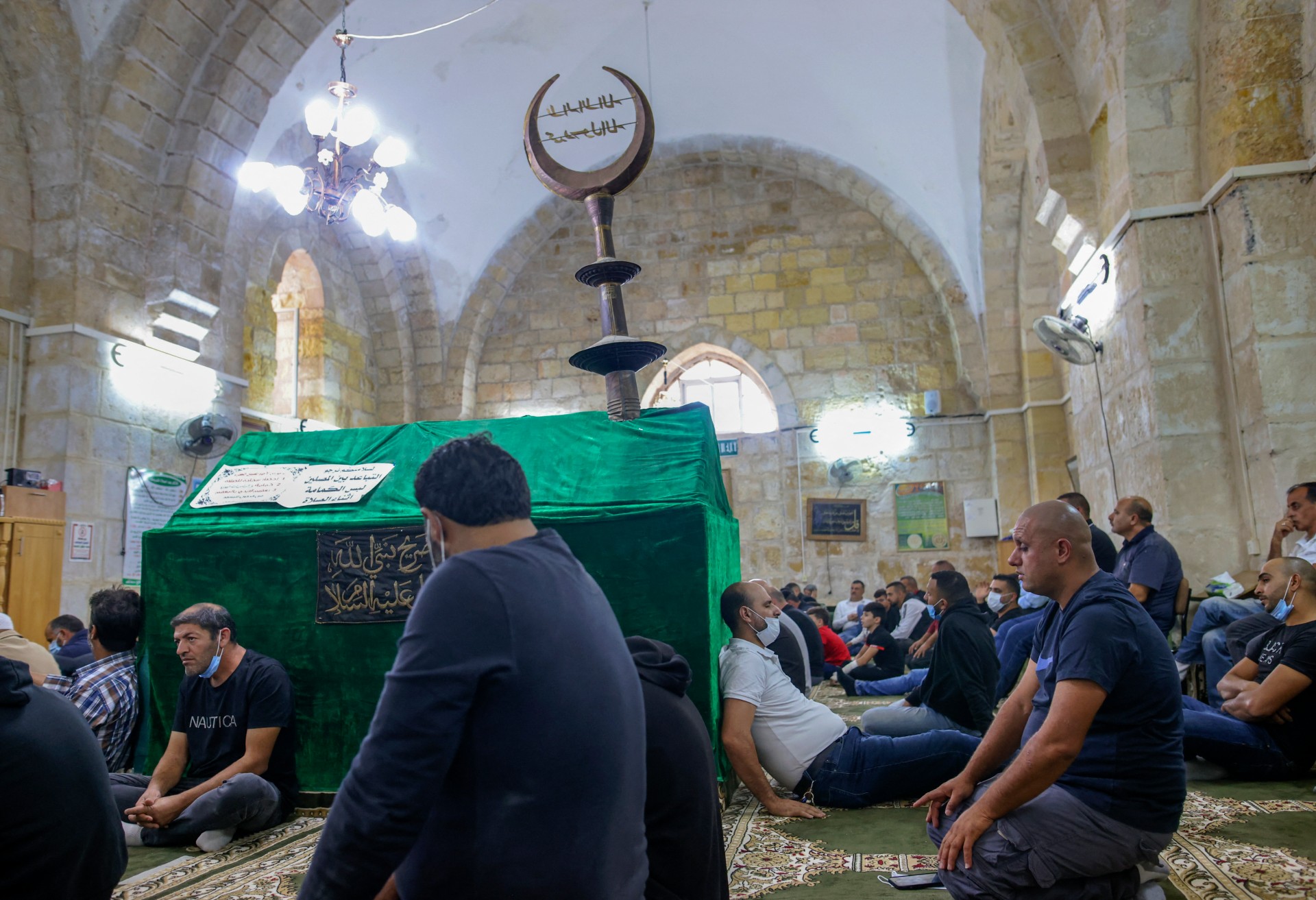 Palestinian Muslim worshippers perform Friday prayers at the Tomb of Samuel mosque in the occupied West Bank on 24 September 2021 (AFP/Ahmad Gharabli)