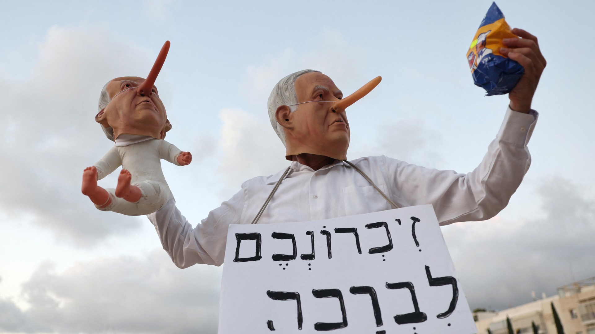 A demonstrator wearing a mask depicting Benjamin Netanyahu during an anti-government protest in Tel Aviv on 31 July 2025, calling for a stop to the war on Gaza (AFP/Jack Guez)