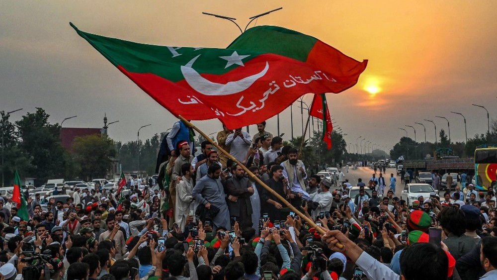 Supporters of Khan take part in a protest in Peshawar on 4 November 2022 (AFP)