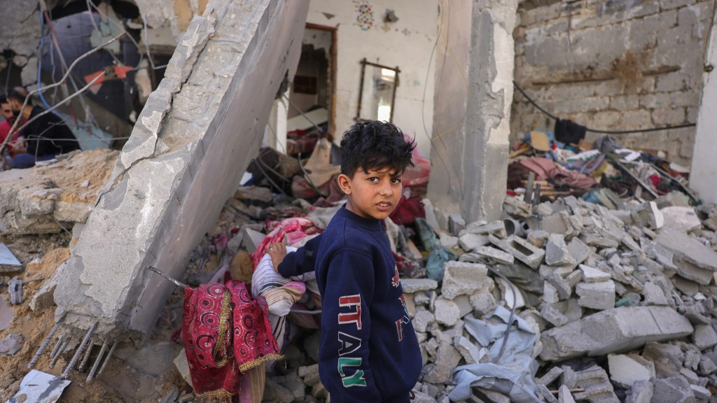 A boy inspects the rubble of a home in Jabalia, Gaza, on 29 May 2025 (Bashar Taleb/AFP)