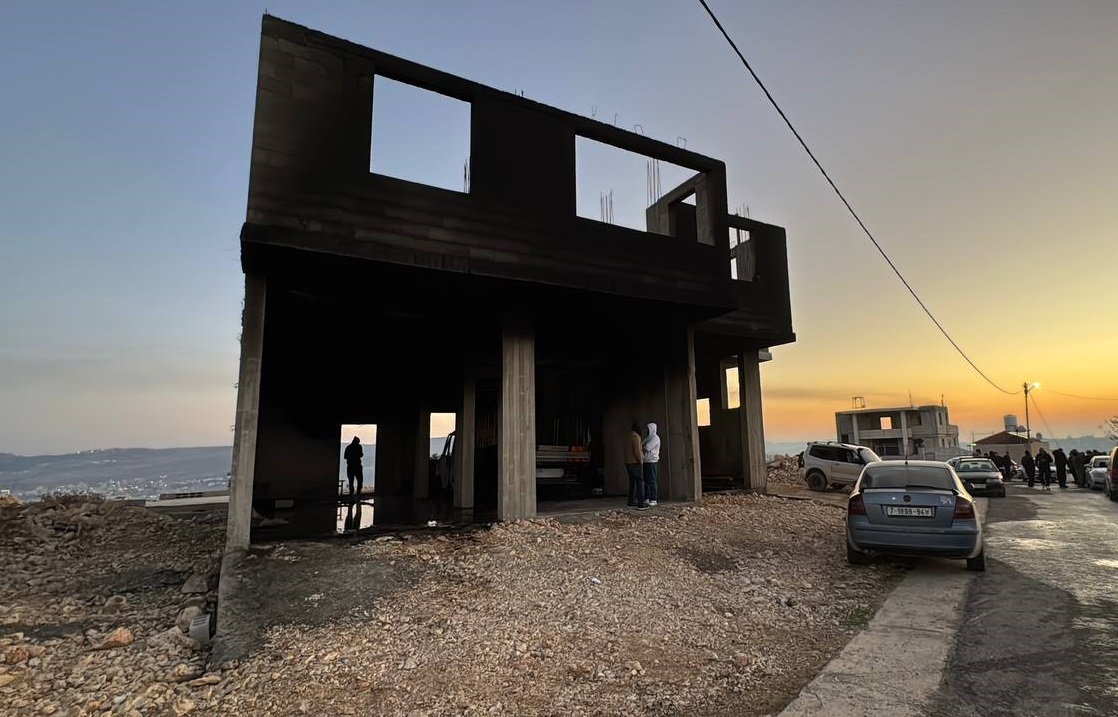 A house under construction left charred after arson attacks by settlers near Nablus (Hisham Abu Shaqrah/MEE)