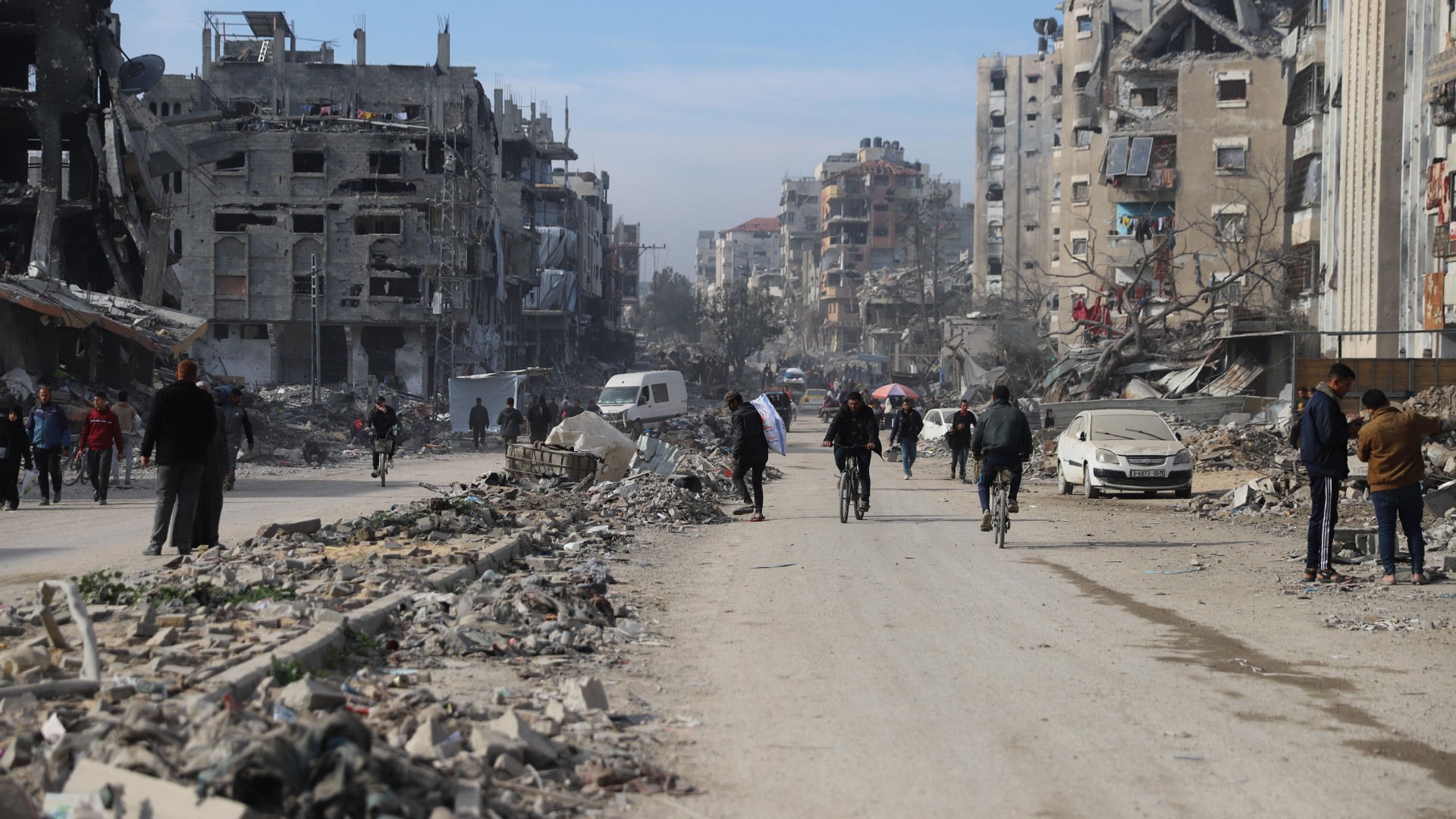 Palestinians inspect the damage done to their homes in Gaza City on 2 February 2025 after 15 months of devastating Israeli attacks (Mohammed al-Hajjar/MEE) 