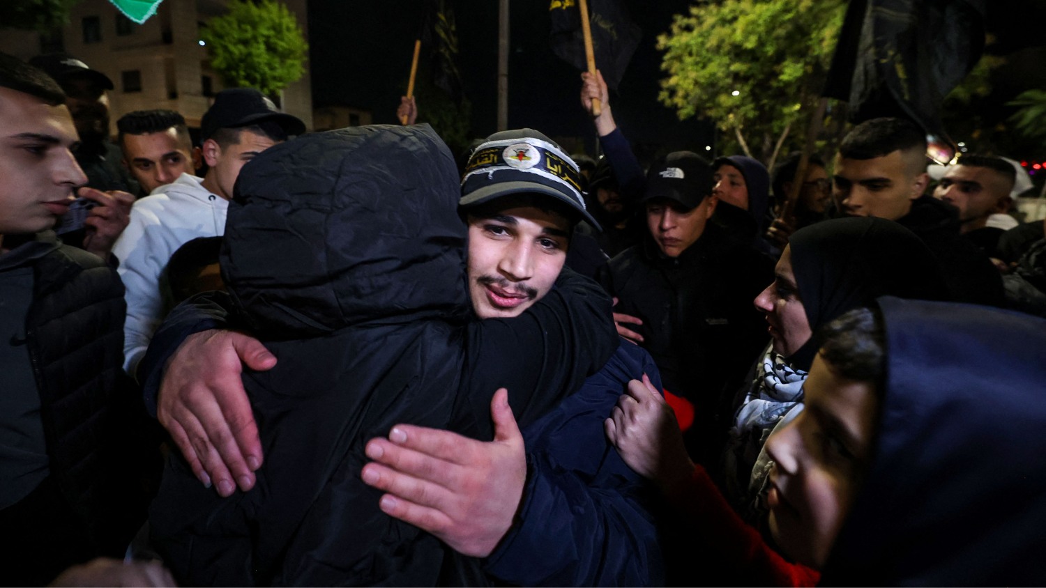 A newly released prisoner hugs a relative during a welcome ceremony after the release of Palestinian prisoners from Israeli jails in Ramallah in the occupied West Bank early on 1 December 2023.