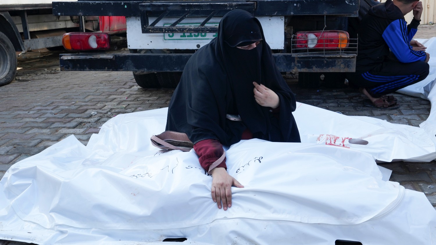 A Palestinian woman mourns relatives who were killed in the Israeli bombardment of the Gaza Strip in Deir al Balah on 1 December 2023.
