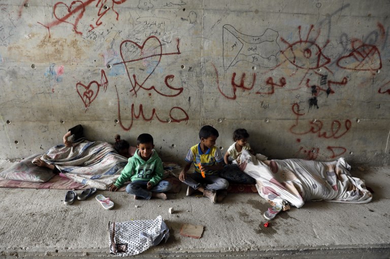 Palestinian children play under a bridge near the Khan al-Ahmar Bedouin village slated for demolition (AFP)