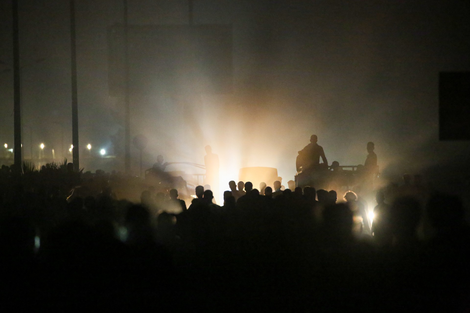 Palestinians gather at an aid distribution point in the Bureij refugee camp in central Gaza on 9 June 2025 (AFP/Eyad Baba)
