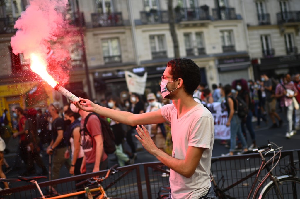 Protesters demonstrate over wages and jobs in Paris on 17 September (AFP)