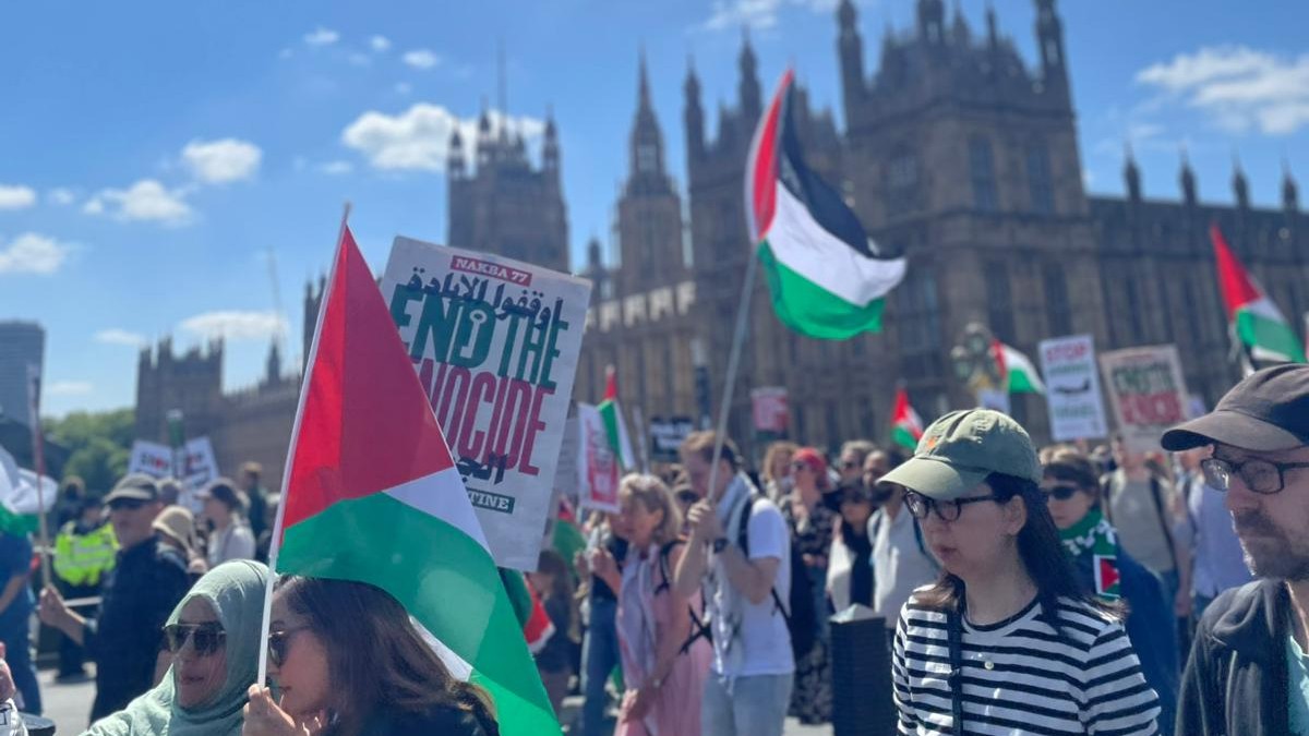 Protestors march through Westminster in central London (Middle East Eye)