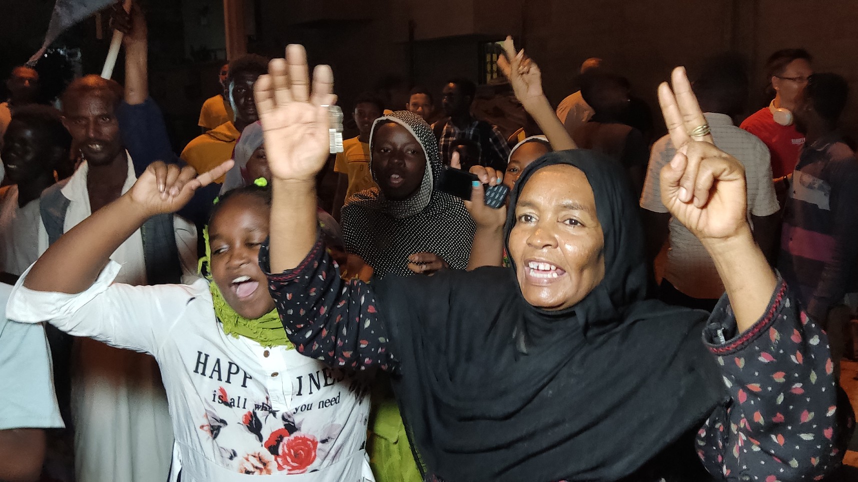 People take to the streets of Port Sudan to celebrate the taking the capital Khartoum by the army from the paramilitary Rapid Support Forces, on March 26, 2025. 