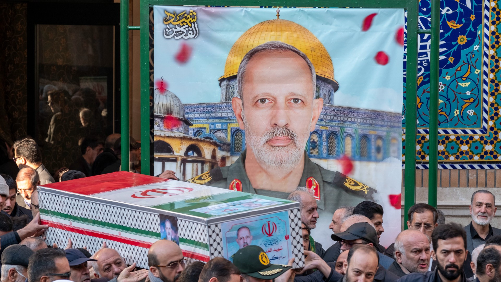Iranian mourners carry a coffin containing the body of General Kioumars Pourhashemi during a funeral in Tehran on 30 November, 2024 (Reuters/Morteza Nikoubazl/NurPhoto)