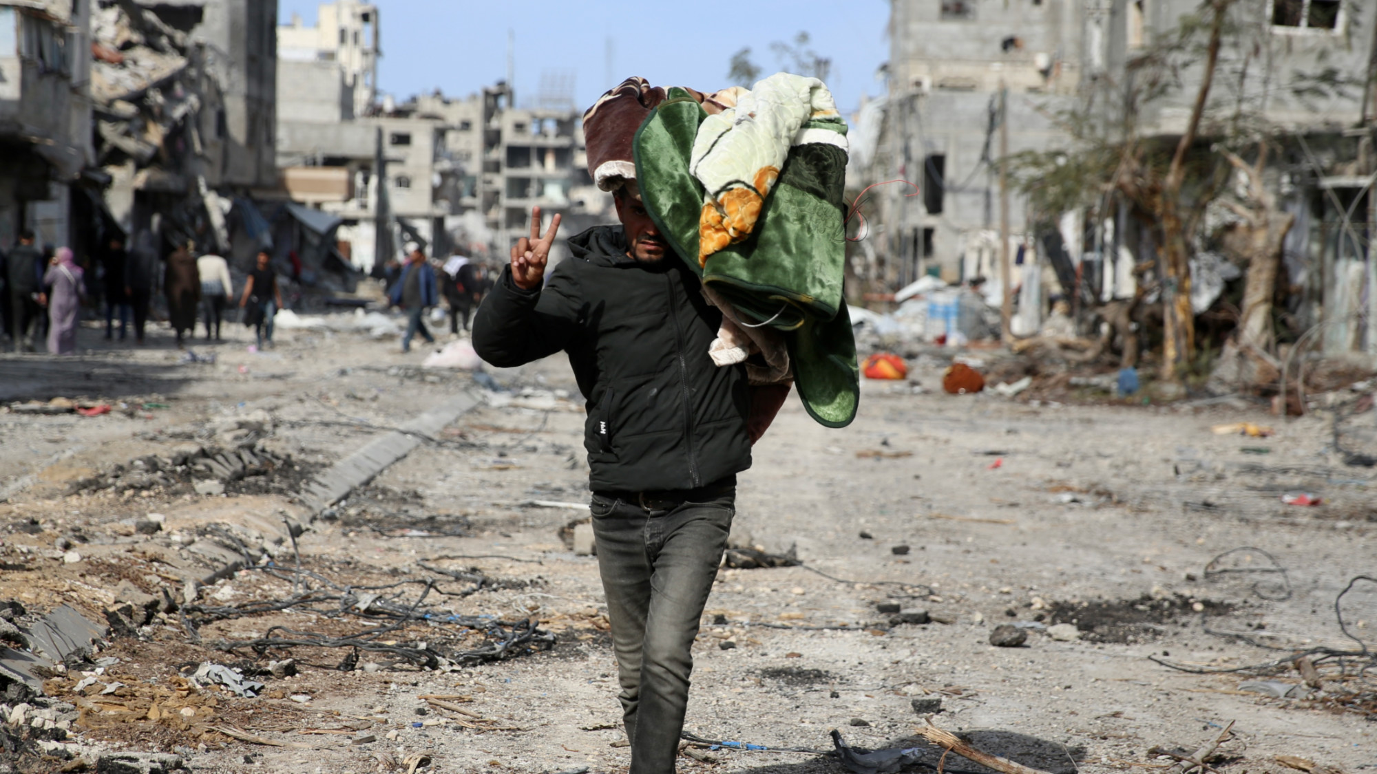 A man gestures as he returns to his home in Rafah on 19 January 2025 (MEE/Mohammed al-Hajjar) 