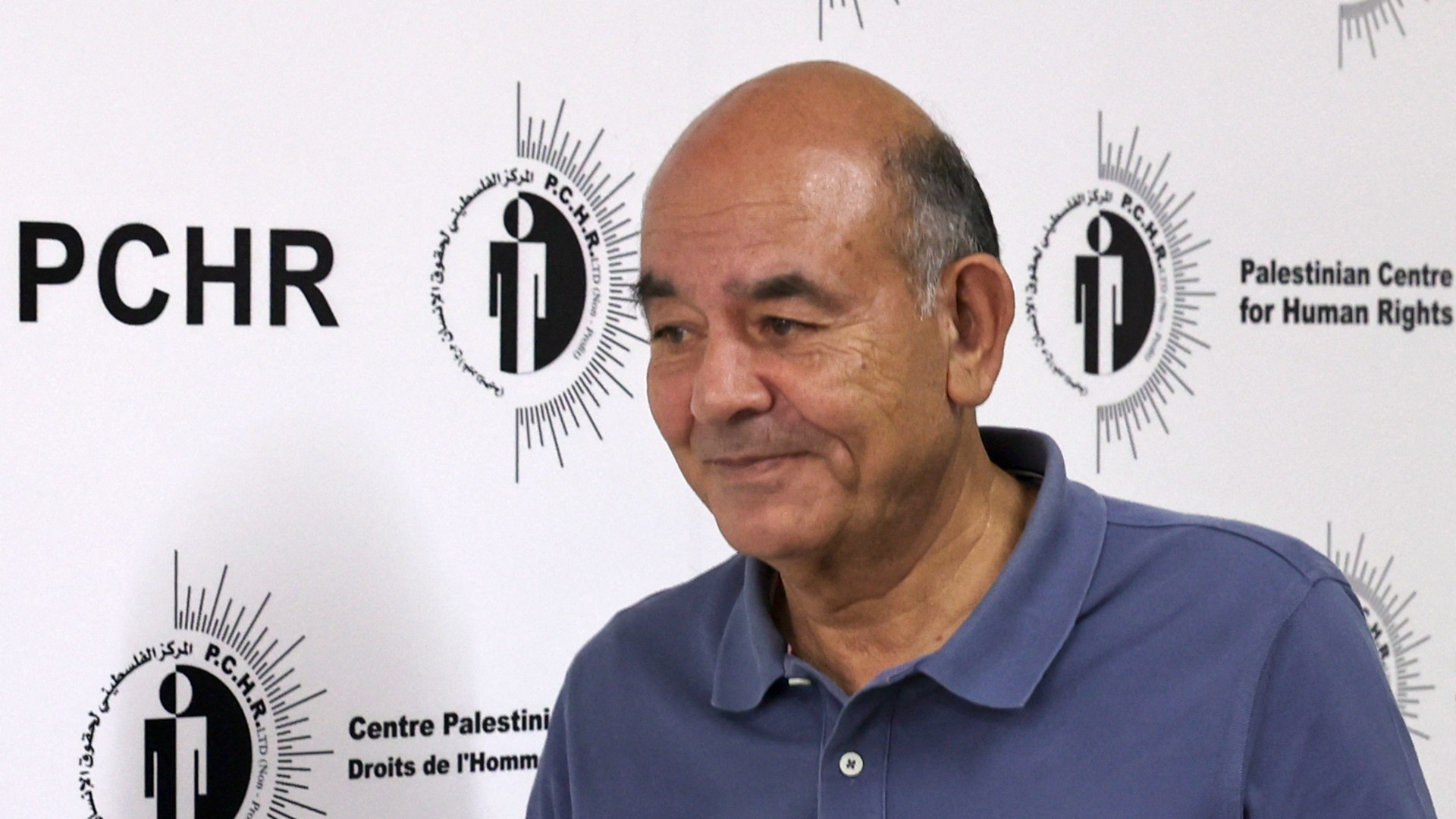 Palestinian human rights lawyer Raji Sourani walks at his office overlooking war-battered Gaza on June 23, 2021.