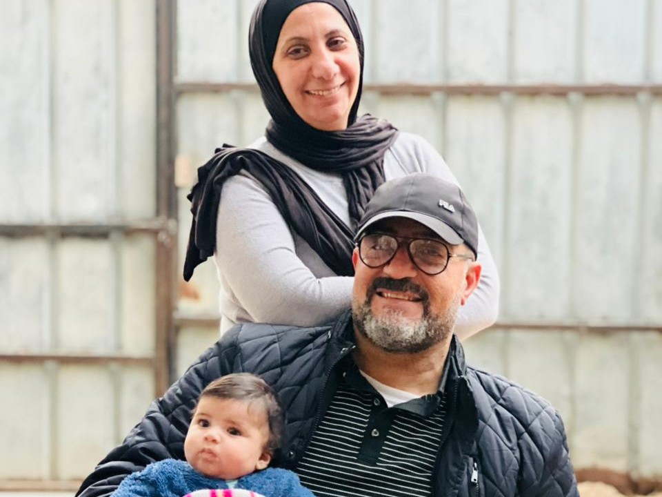 Palestinian adopting parents with Jannah