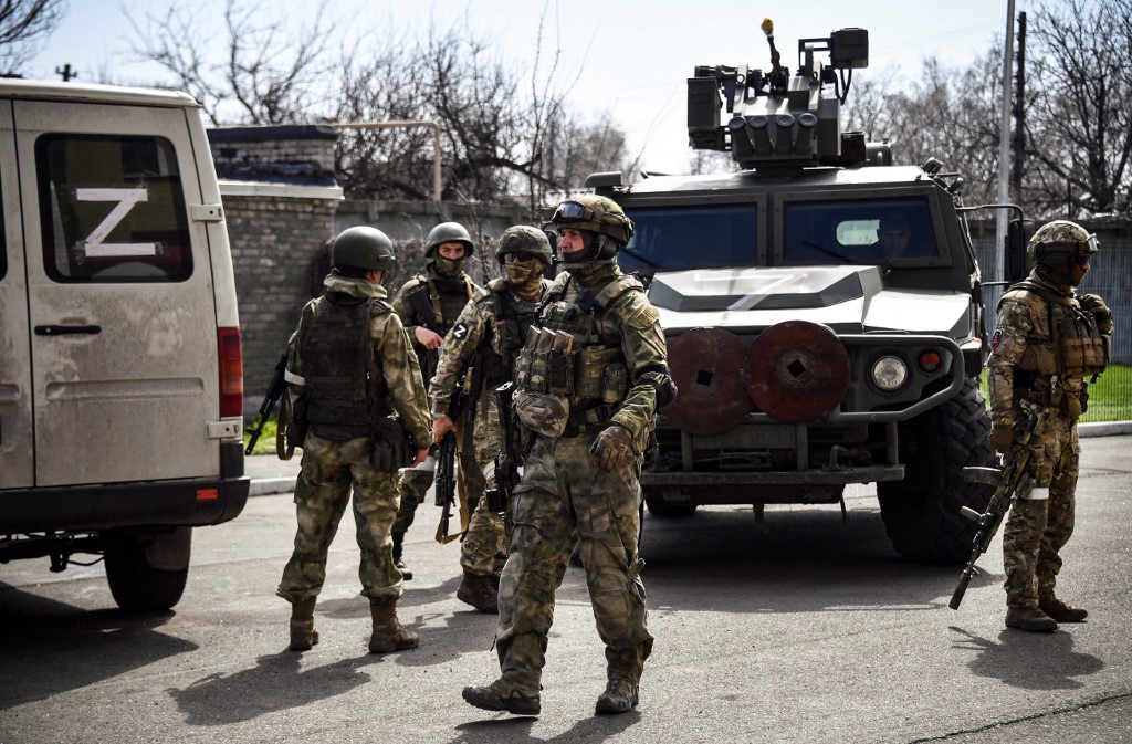 Russian soldiers patrol a street in the Donetsk region on 11 April 2022 (AFP)
