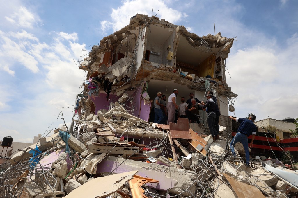 People check the devastation in a house after Israeli troops surrounded it and reportedly killed five people who were inside, during an army raid on Tammun in the occupied West Bank on May 15, 2025.
