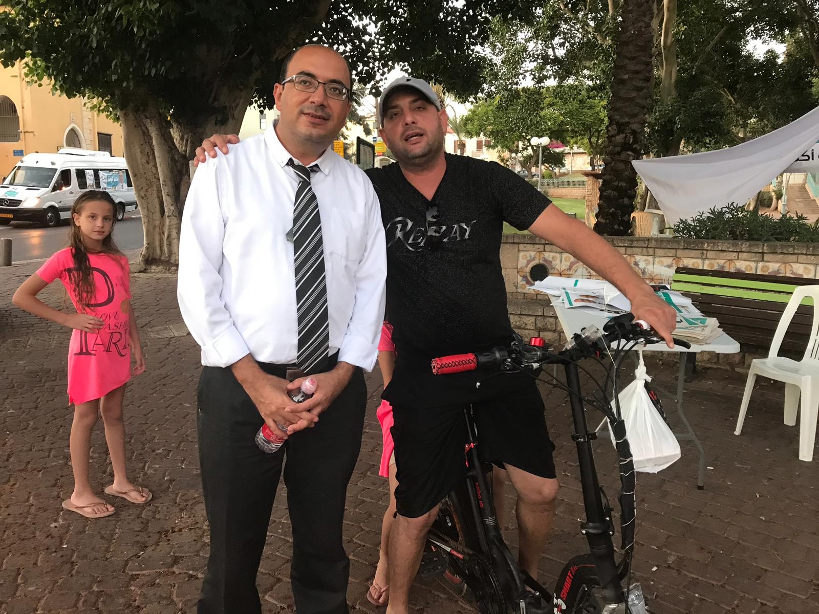 Sami Abu Shehada, centre, at a polling station in Jaffa (MEE)