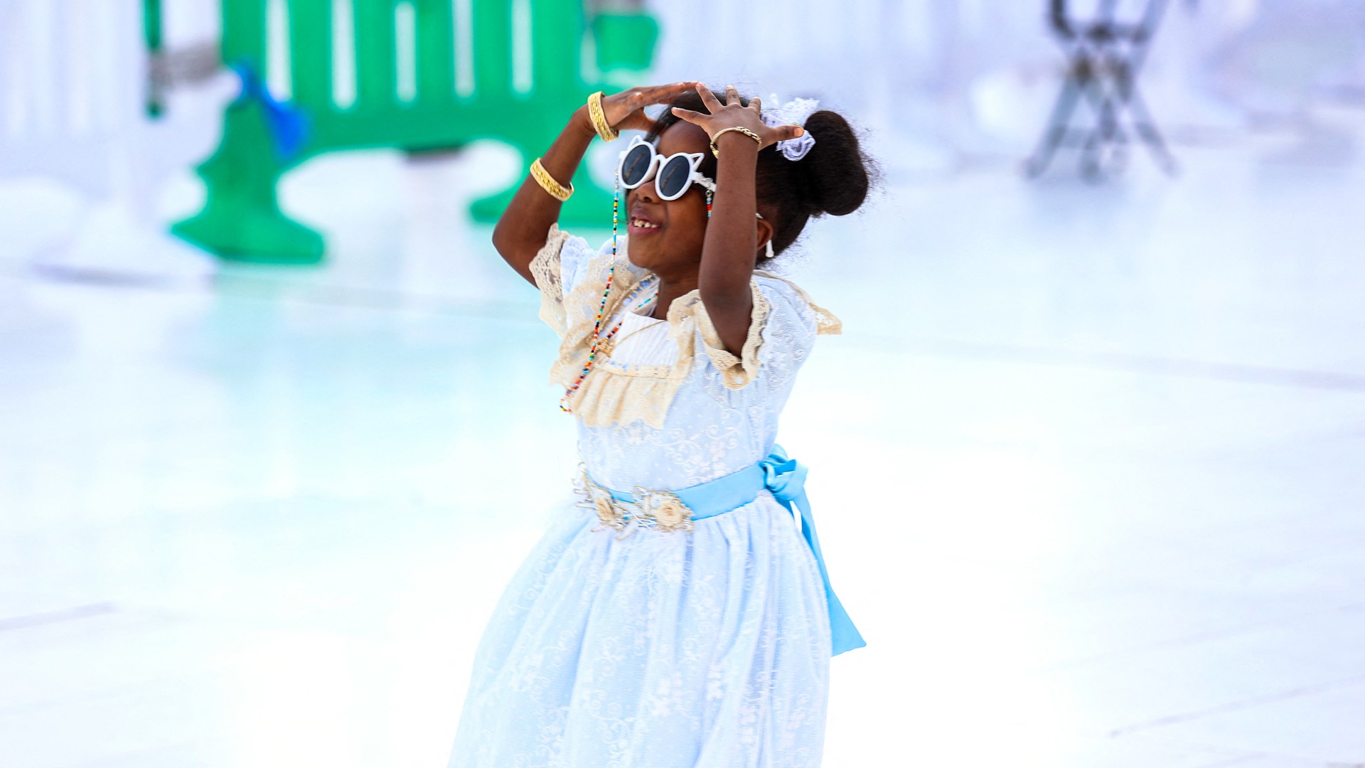 A girl gestures as Muslim pilgrims perform Eid prayers at the grand mosque in Islam's holy city of Mecca on 28 June 2023 (Abdel Ghani Bashir/AFP)