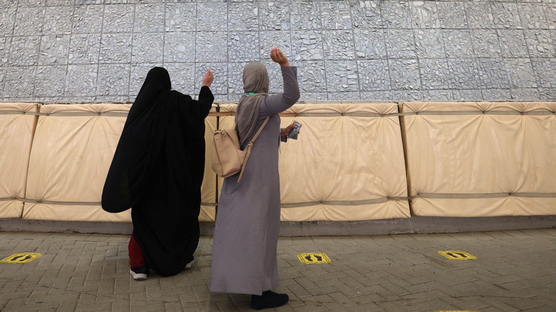 Muslim worshippers cast stones as part of a symbolic stoning of the devil ritual, during the Hajj pilgrimage on 20 July 2021 (Fayez Nureldine/AFP)
