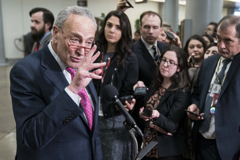 Senate Minority Leader Chuck Schumer speaks to reporters in Washington on 29 January (AFP)