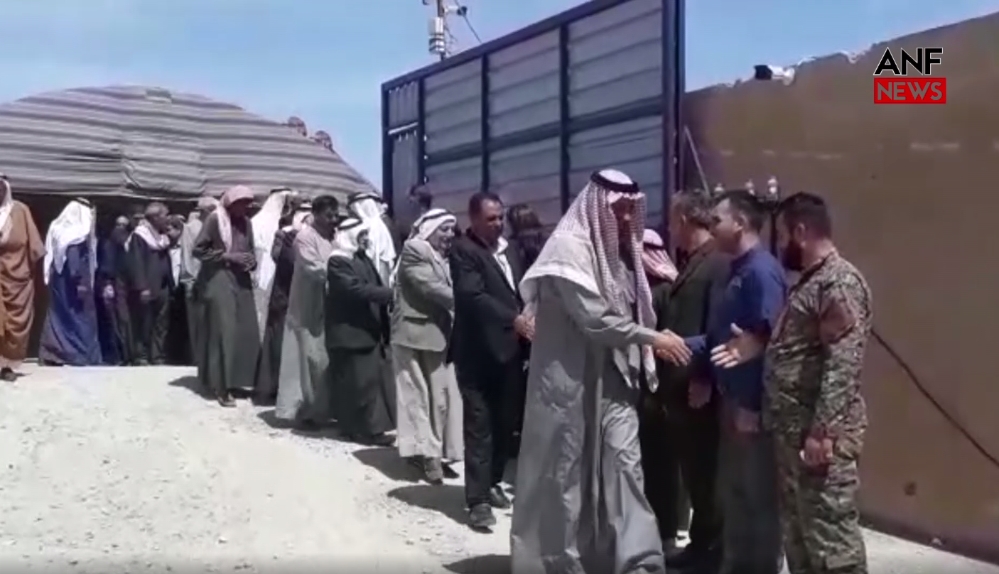 A still from a video posted on the Firat News Agency shows Arab tribal leaders attending a conference in Ain Issa (screengrab)