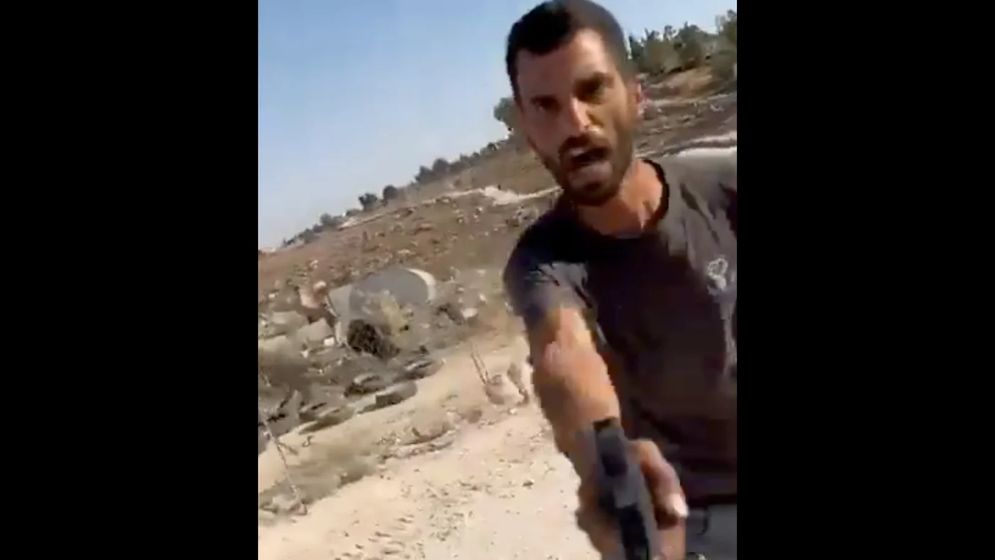 Yinon Levi, a settler sanctioned by the US, is seen shooting at Palestinians in the occupied West Bank, on 28 July 2025 (X/@yuval_abraham/Screengrab)