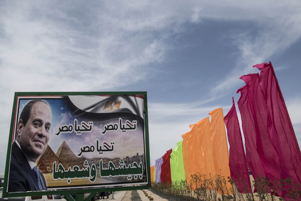 A poster of Egyptian President Abdel Fattah al-Sisi is seen during the inauguration of a tunnel in Ismailia city on 5 May (AFP)