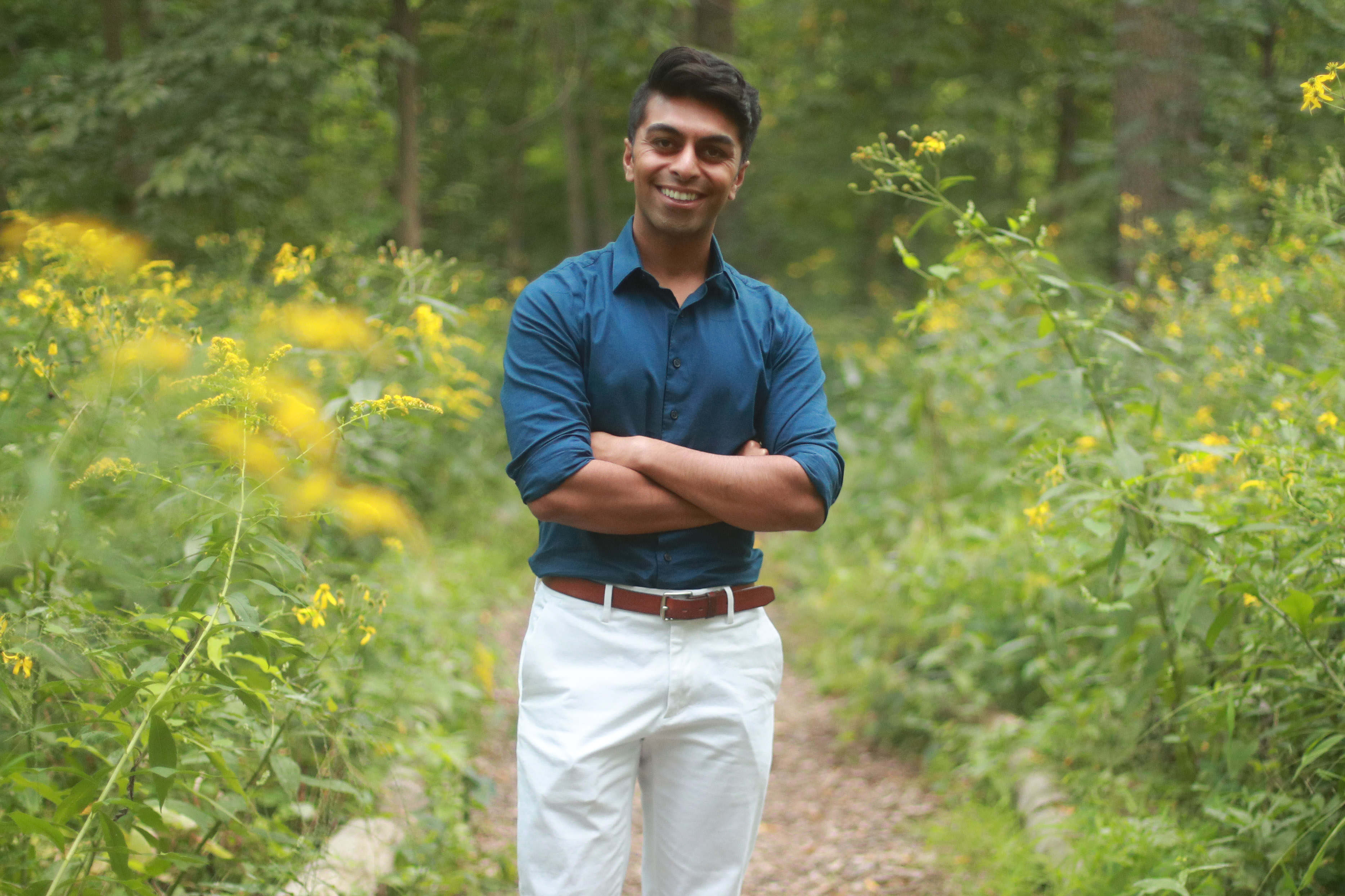 Solomon Rajput standing in a nature path.