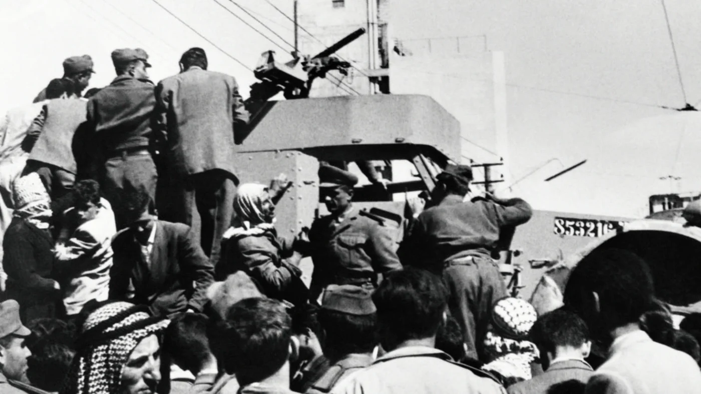 Crowds in Damascus mob an Israeli armoured vehicle, seized by the Syrian army during Israeli-Syrian tensions in March 1962 (AFP)
