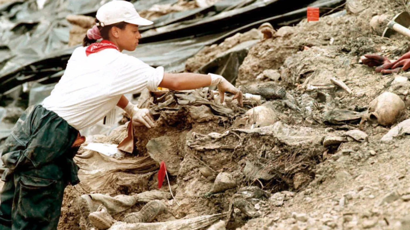 July 1996: An ICTY investigator at a mass grave near Srebrenica, Bosnia, where up to 8,000 Muslims were massacred forces by Bosnian Serbs in 1995 (AFP).