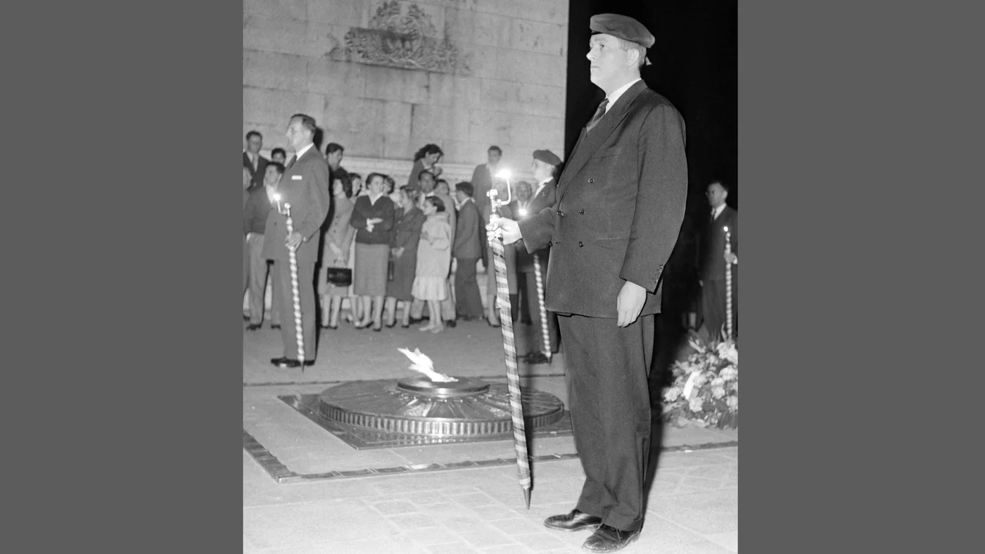 Jean-Marie Le Pen takes part in a Dien Bien Phu commemoration ceremony organised by the Front National of Combatants at the Arc de Triomphe on 8 May 1958 (AFP)