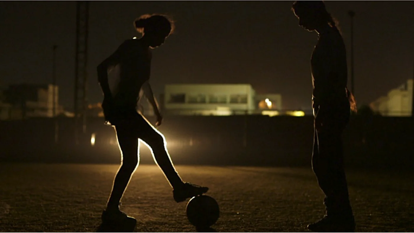 football practice in dark power cuts Tripoli