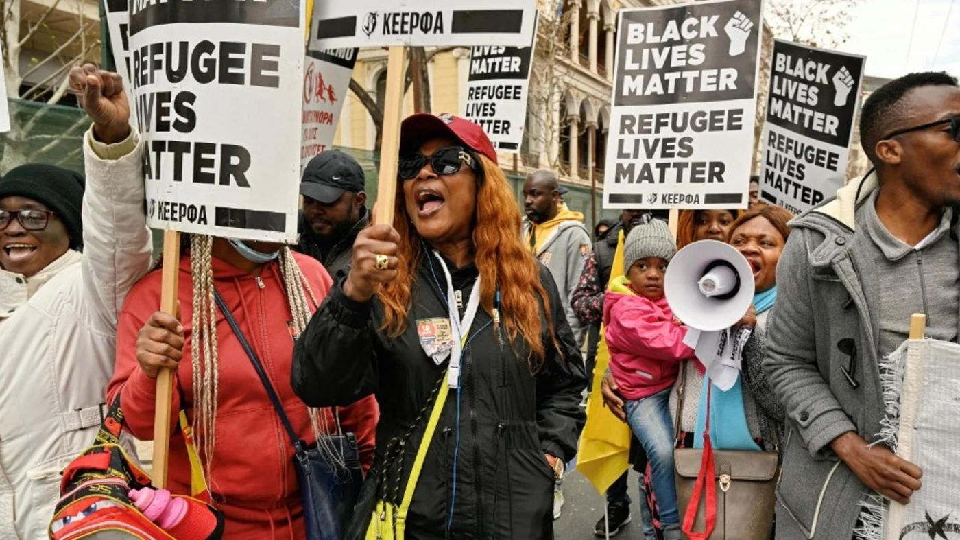Refugees chant slogans during a demonstration in Athens on March 18, 2023 against Greece's strict migration policies, accusing the conservative government of 