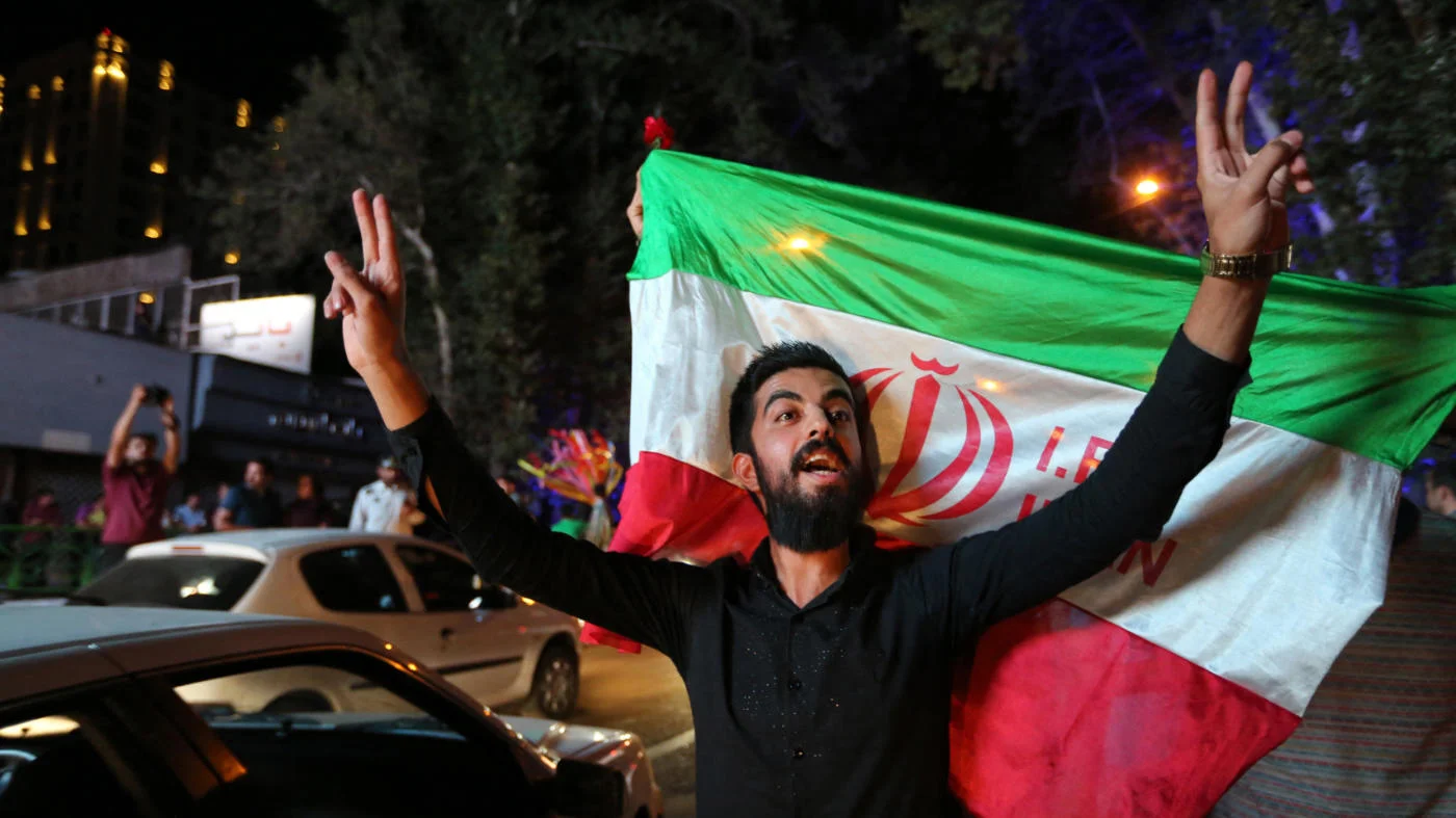 Iranians celebrate in Tehran amid the nuclear deal struck in Vienna in July 2015 which potentially would see an end to sanctions (AFP)