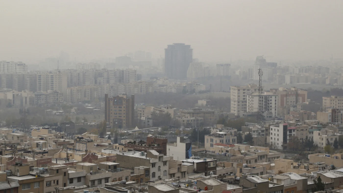 Pollution chokes Tehran in December 2023, forcing some workplaces and schools to shut. The problem is worse during the colder autumn and winter months (AFP)