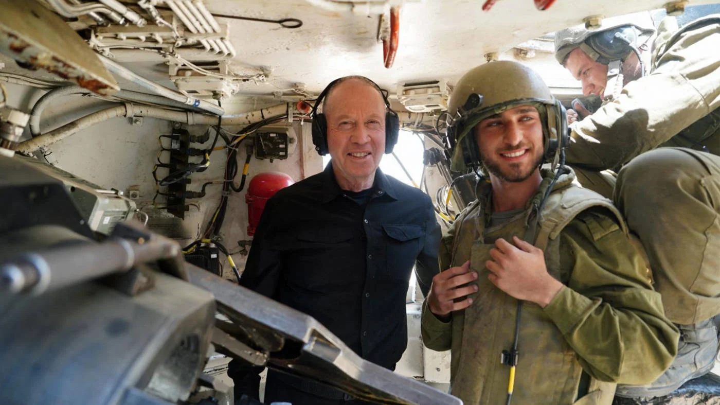 Israeli Defence Minister Yoav Gallant visits troops inside a self-propelled artillery howitzer at near the Israeli border with Rafah, southern Gaza, in May 2024 (AFP/Israeli Army handout)