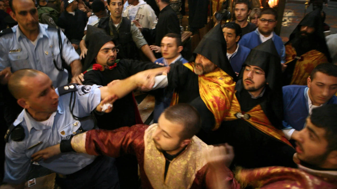 A fight between Armenian and Greek Orthodox clergy at the Church of the Holy Sepulchre, Jerusalem, in November 2008 during the Armenian feast of the Holy Cross (AFP)