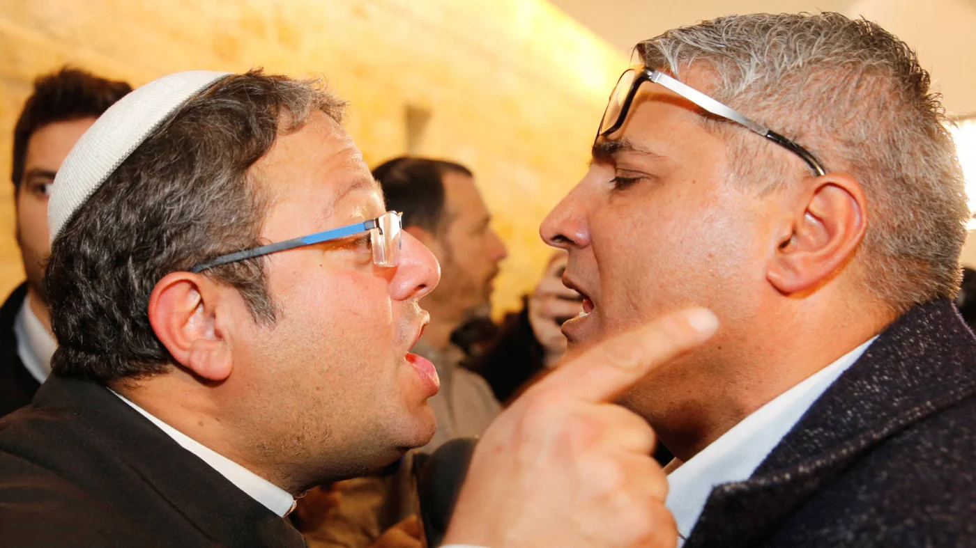 Itamar Ben Gvir left argues with the Israeli Arab candidate Ata Abu Medeghem of Raam-Balad after a hearing at the Israeli Supreme Court in Jerusalem, on 14 March 2019 (AFP) 