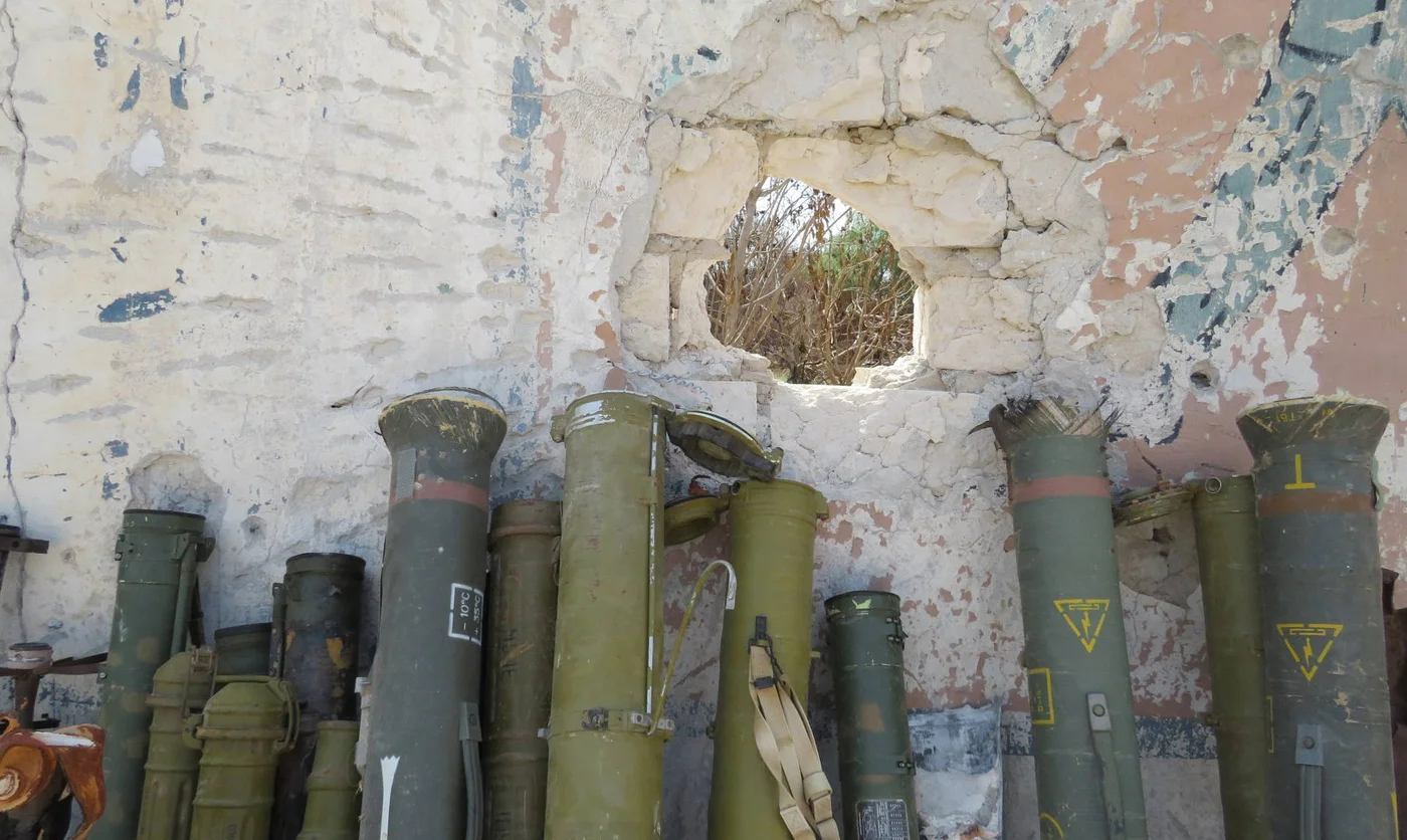 Rocket launchers recovered from residential battlefields and brought to a military base in Tripoli (MEE/Daniel Hilton)