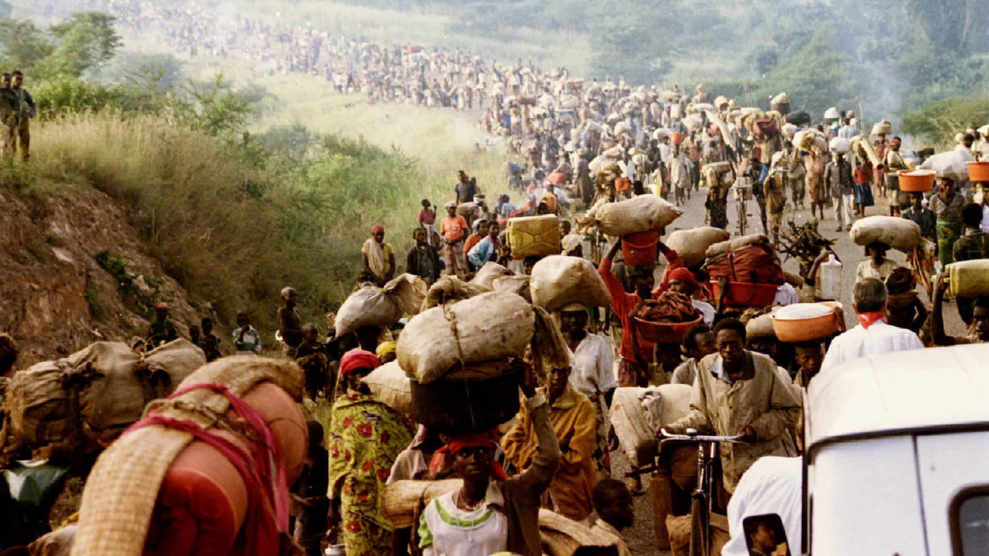 Rwandan refugees cross Rusumo border to Tanzania from Rwanda in May 1994 amid the genocide (Reuters)