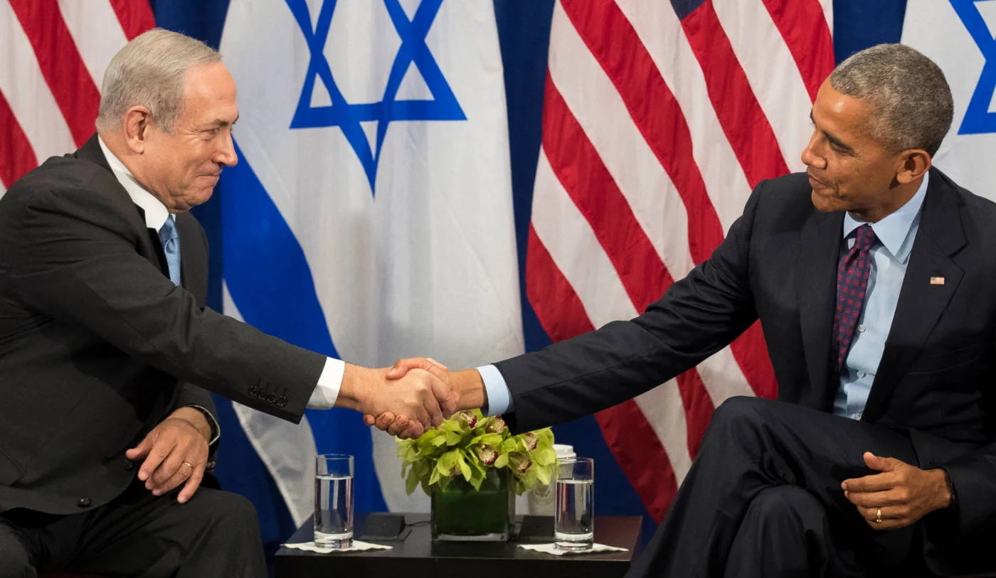 Prime Minister of Israel Benjamin Netanyahu shakes hands with US President Barack Obama in New York City in September 2016, one week after Washington agreed to a multi-billion military aid deal (AFP)