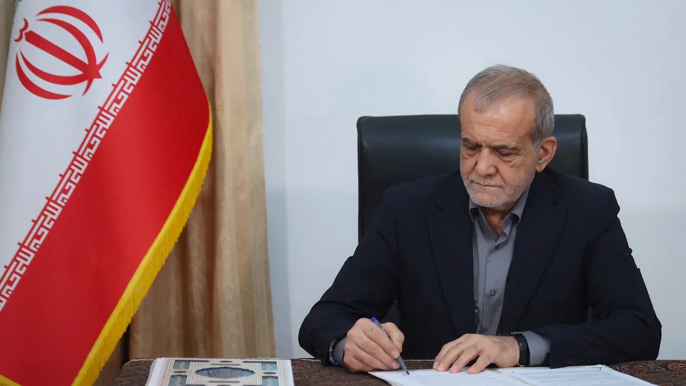 Iranian President Masoud Pezeshkian signs the memorandum of understanding to end the war with the United States and Israel, in Tehran on 18 June 2026 (Iranian Presidency Handout/AFP)
