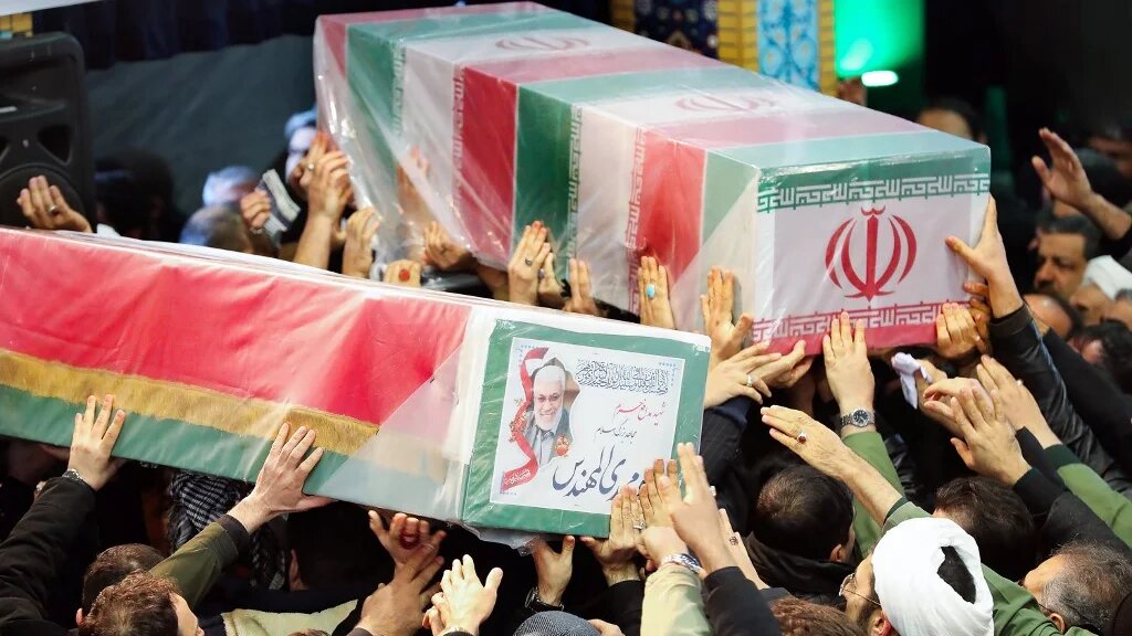 The caskets of Soleimani and Iraqi paramilitary chief Abu Mahdi al-Muhandis were carried through to the front at Tehran University (AFP)