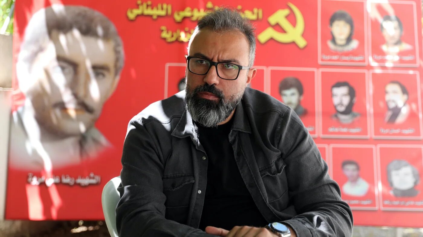 Together Towards Change Lebanese candidate Ayman Mroueh speaks to MEE from the headquarters of the Lebanese Communist Party in Zrariyeh, south Lebanon (MEE/Hasan Shaaban)