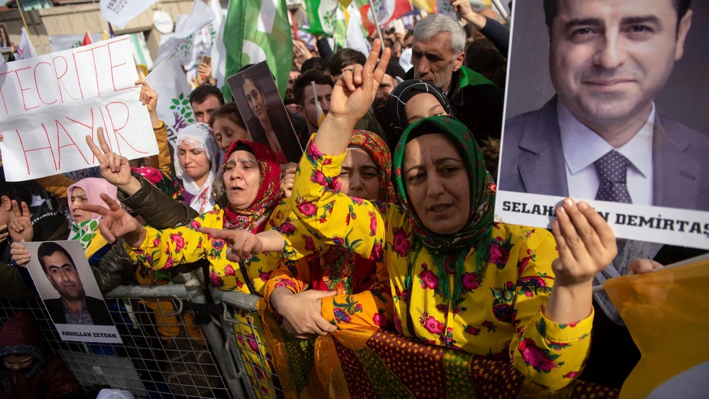 Supporters of the pro-Kurdish Peoples' Democratic Party (HDP) hold a picture of jailed former party leader Selahattin Demirtas as they attend a 'Peace and Justice' rally in Istanbul on February 3, 2019 (AFP)