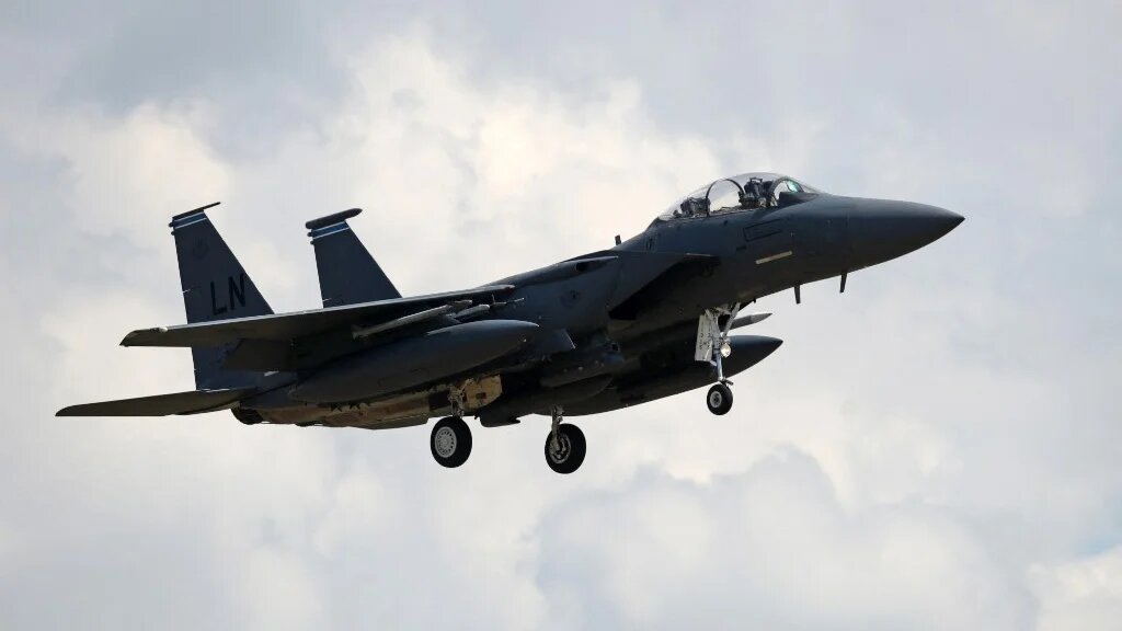 A US Air Force (USAF) F-15E Eagle fighter jet, is pictured as it prepares to land at RAF (Royal Air Force) Lakenheath, east of England, on June 15, 2020. (AFP)
