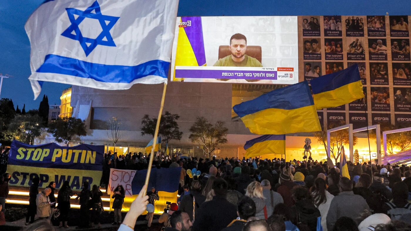 Demonstrators gather at Habima Square in the centre of Israel's Mediterranean coastal city of Tel Aviv on March 20, 2022 to attend a televised video address by Ukraine's President Volodymyr Zelensky to the Israeli Knesset (AFP)