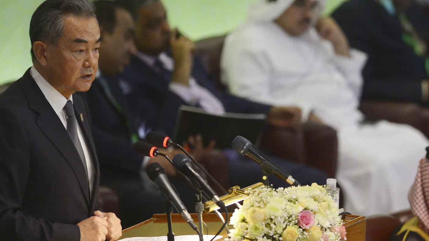 Chinese Foreign Minister Wang Yi speaks in Islamabad during the 48th session of foreign ministers of the Organisation of Islamic Cooperation, on 22 March 2022 (AFP)
