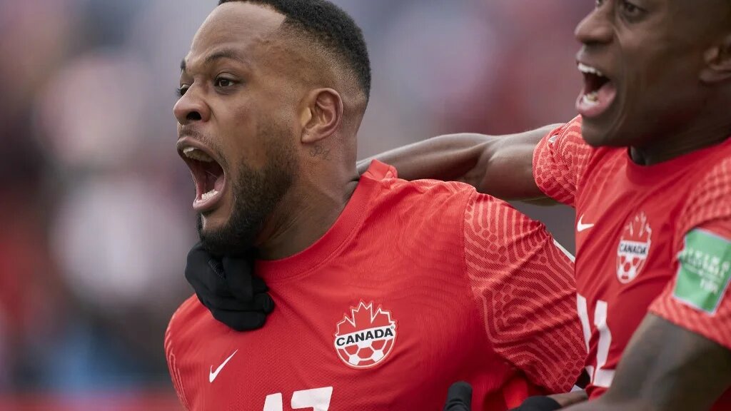 Canada’s Cyle Larin celebrates his goal with teammate Richie Laryea during their World Cup Qualifying match against Jamaica at BMO Field in Toronto on 27 March 2022. (AFP)